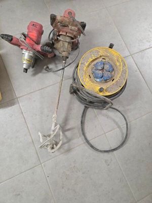 a fire hydrant that is sitting on the floor next to a hose