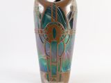 a vase with a design on it on a white surface