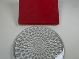 a glass plate with a red box on the table