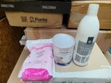 a bottle of lotion and a package of lotion sitting on a table