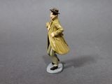a figurine of a man in a trench coat and hat