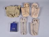 six pairs of canvas pouchs and a blue bottle on a white surface