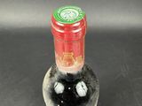 a bottle of wine that is sitting on a table