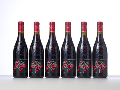 six bottles of red wine lined up in a row