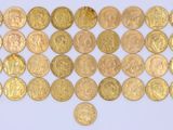 gold coins arranged in a triangle on a blue background