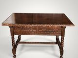 an old wooden table with a drawer on top of it