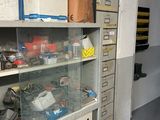 a room that has a lot of clutter on the shelves