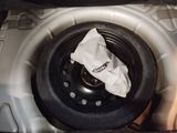a car tire with a bag in the back of it