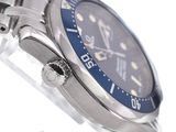 a close up of a watch with a blue face