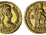 une pièce d'or portant l'image d'une femme et d'un homme