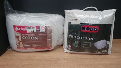 two bags of cotton on the table next to each other