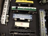 a lot of toy trains that are on the table