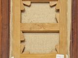 an old picture of a wooden frame with a picture in it