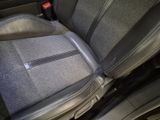 a seat in the back of a car that has a zipper on it