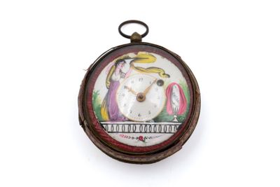 une photo d'une montre de poche sur laquelle figure l'image d'un oiseau