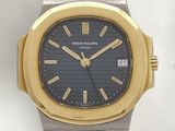 an image of a gold and silver wrist watch with a black dial