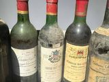 several bottles of wine are lined up in a row