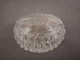 an image of a clear glass bowl on a gray surface