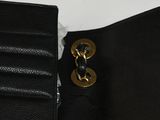 black leather wallet with a gold metal clasp and a black leather wallet with a gold metal clasp and a black leather wallet with a black leather wallet with a gold metal