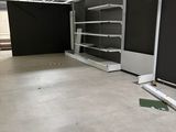 a large empty room with shelves and shelves in it