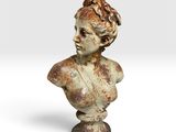 un gros plan sur la statue d'une femme posée sur un socle