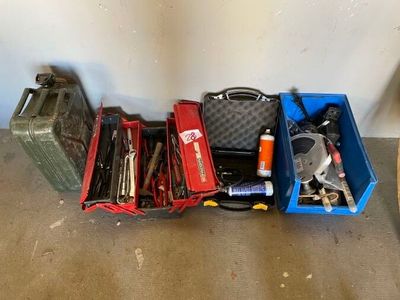 a lot of tools that are sitting in a blue box