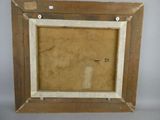 an old picture of a wooden frame with a picture in it