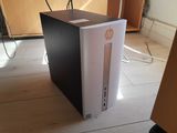 a white and black desktop computer sitting on the floor