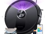 a close up of a robotic vacuum cleaner with a remote control