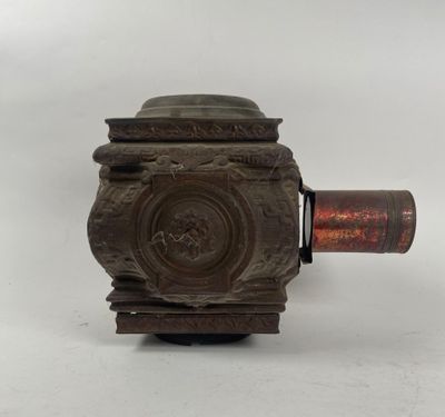 an old metal object on a white surface with a white background