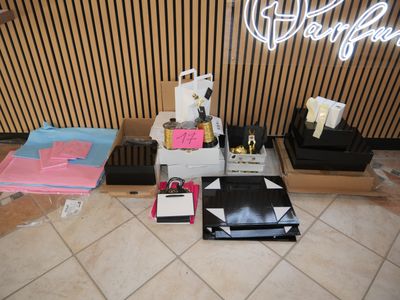 many items that are sitting on the floor in front of the counter