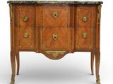 an antique wooden chest of drawers with marble top