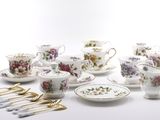 many different types of tea cups and saucers on the table