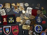 many different types of badges and badges on a table