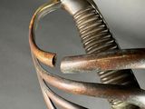 a close up of a sword with a metal handle