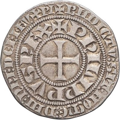 a silver coin with a cross in the middle of it
