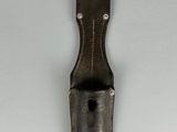 an image of a metal object on a white surface
