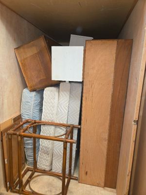 a small room with a bed and a chair in it