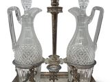 pair of crystal decanters on a silver tray with a handle