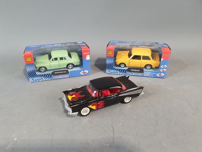 three toy cars that are sitting next to each other