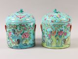 pair of chinese famille porcelain jars with birds and flowers on them
