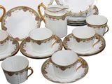 many different types of porcelain dishes and cups and saucers