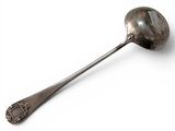 a silver spoon with a spoon handle on a white surface