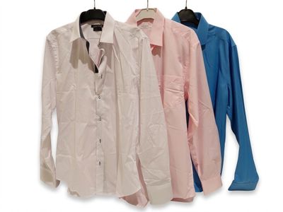three shirts hanging on a clothes rack on a white background
