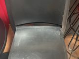 a metal chair that is sitting on the floor