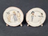 two plates with a picture of a couple of people on them