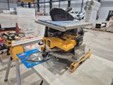 a table with a table saw on it in a building