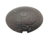 a wooden bowl with a metal lid on a white surface