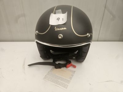 a helmet with a tag on it sitting on a table