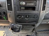 a dashboard of a truck with a radio and a steering wheel